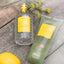 4711 Acqua Colonia Lemon & Ginger Flakon und Duschgel neben Fenchelblüten und Zitrone